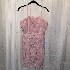 Pink floral textured, fitted dress. Great for a wedding guest!